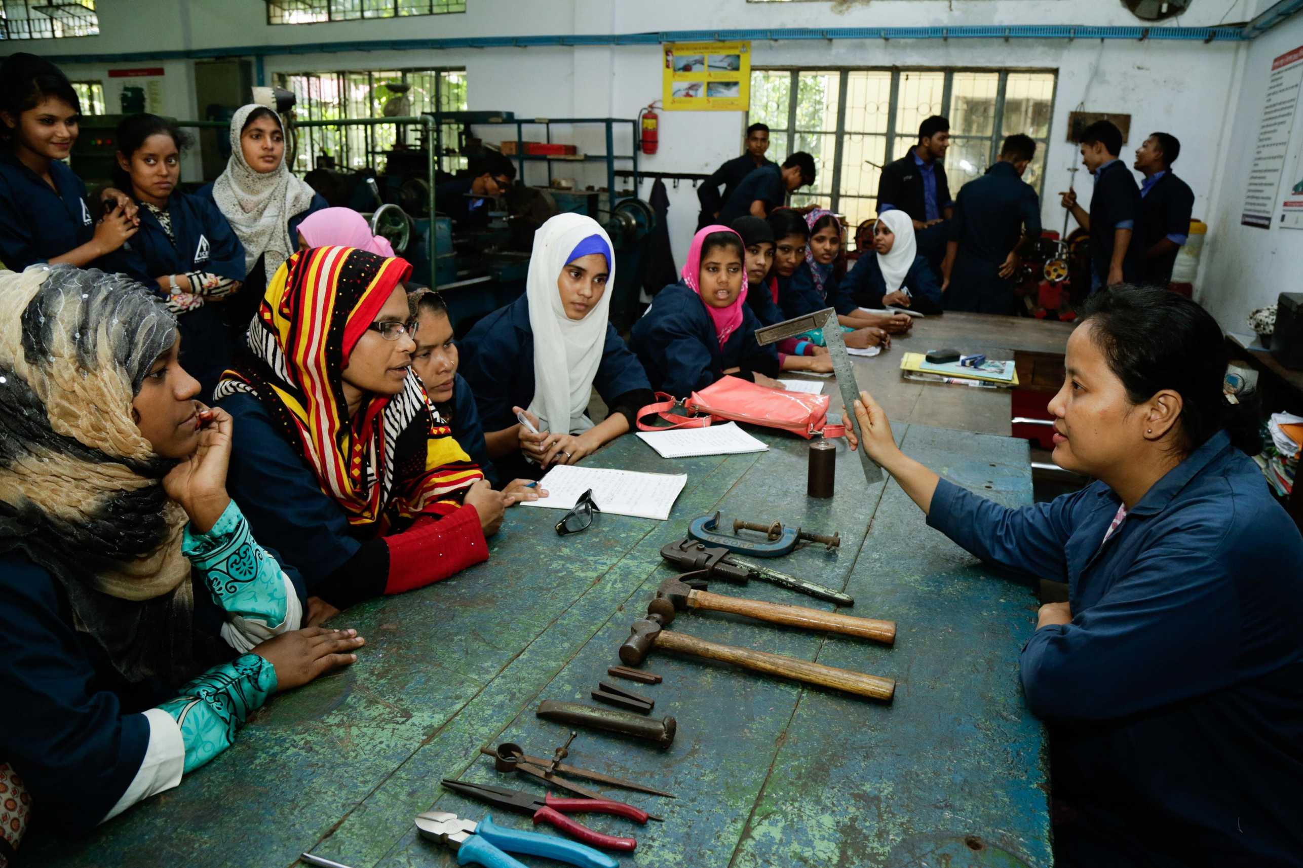 A trainer shows different kinds of tools to the trainees in a skills for investment progamme in Chittagong. 